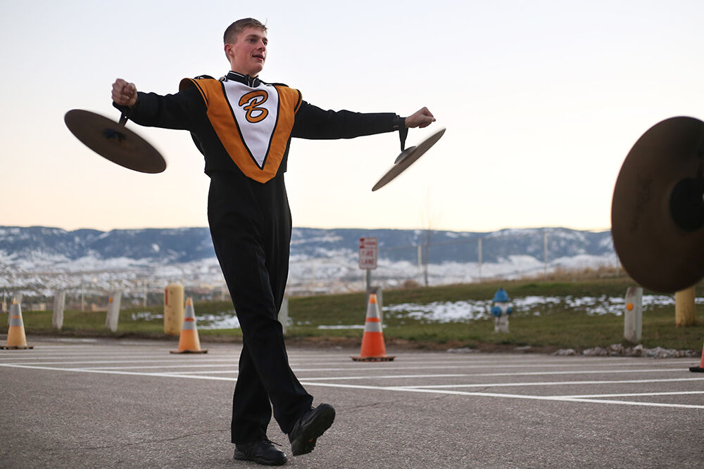Joseph Monney waves the cymbals around his wrists